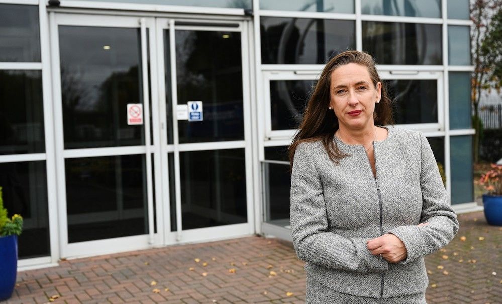 Caroline Green Standing in front of Doors