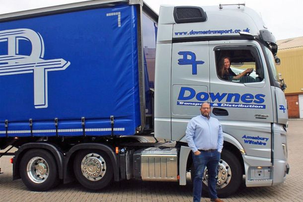 Woman Driving Downes Blue Lorry with Man Standing Beside it