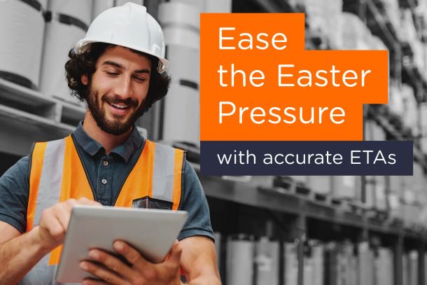 Man wearing Hi Viz holding Tablet in Warehouse